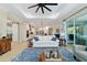 Spacious living room showcasing an open layout to the kitchen and comfortable seating on a blue patterned rug at 10445 Sw 90Th Street Rd, Ocala, FL 34481