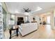 Bright living room boasts stylish furnishings, recessed lighting, and a ceiling fan at 10445 Sw 90Th Street Rd, Ocala, FL 34481