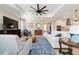 Comfortable living room showcasing an open layout to the kitchen with comfortable seating and natural light at 10445 Sw 90Th Street Rd, Ocala, FL 34481