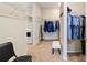 Walk-in closet featuring ample storage and shelving space, plus a washer and dryer hookup at 10445 Sw 90Th Street Rd, Ocala, FL 34481