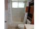Bathroom featuring a shower/tub combo, vanity, and built-in storage at 10955 Sw 89Th Ave, Ocala, FL 34481