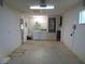 Unfinished garage with white washer and dryer at 10955 Sw 89Th Ave, Ocala, FL 34481
