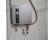 Wall-mounted on-demand hot water heater at 10955 Sw 89Th Ave, Ocala, FL 34481