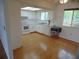 Bright kitchen with white cabinets, flooring and appliances at 10955 Sw 89Th Ave, Ocala, FL 34481