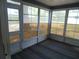 Enclosed lanai with wall-to-wall windows, perfect for enjoying the outdoors at 10955 Sw 89Th Ave, Ocala, FL 34481