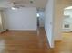 Bright living room with hardwood floors that opens to kitchen at 10955 Sw 89Th Ave, Ocala, FL 34481