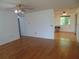 Spacious living room with hardwood floors that flows into the kitchen at 10955 Sw 89Th Ave, Ocala, FL 34481