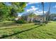 Private backyard featuring a screened enclosure and well-maintained lawn, ideal for outdoor living at 11645 Sw 75Th Cir, Ocala, FL 34476