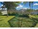 Spacious backyard featuring a screened enclosure and mature landscaping, ideal for relaxing outdoors at 11645 Sw 75Th Cir, Ocala, FL 34476