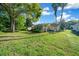Expansive backyard with a screened lanai and mature trees for privacy and outdoor enjoyment at 11645 Sw 75Th Cir, Ocala, FL 34476