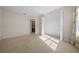 Neutral bedroom with a carpeted floor and an open closet at 11645 Sw 75Th Cir, Ocala, FL 34476