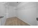 Walk-in closet with carpeted floor and wire shelving for neatly organizing clothes and accessories at 11645 Sw 75Th Cir, Ocala, FL 34476