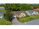 Welcoming single-story home showcasing a manicured lawn and mature landscaping at 11645 Sw 75Th Cir, Ocala, FL 34476