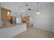 Bright kitchen with tiled floor, wood cabinets, ample counter space and natural light at 11645 Sw 75Th Cir, Ocala, FL 34476