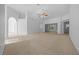 Bright living room featuring neutral carpet, archways and open floor plan at 11645 Sw 75Th Cir, Ocala, FL 34476