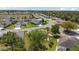 Beautifully landscaped home with a screened-in lanai and a well-kept lawn in a quiet neighborhood at 11828 Se 91St Cir, Summerfield, FL 34491