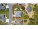Aerial view of a meticulously landscaped home with a defined property line, offering privacy and curb appeal at 11828 Se 91St Cir, Summerfield, FL 34491
