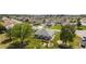 Aerial view of a beautiful home showcases its well-maintained yard and desirable neighborhood setting at 11828 Se 91St Cir, Summerfield, FL 34491