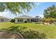 A spacious backyard features a screened lanai perfect for relaxing and outdoor living at 11828 Se 91St Cir, Summerfield, FL 34491