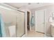 Bathroom featuring glass enclosed shower, tile floors, and a neutral color scheme at 11828 Se 91St Cir, Summerfield, FL 34491