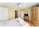 Cozy bedroom with wood floors, neutral walls, and decor providing a peaceful retreat at 11828 Se 91St Cir, Summerfield, FL 34491