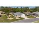 Attractive home on a well-maintained street, showcasing manicured landscaping and inviting curb appeal at 11828 Se 91St Cir, Summerfield, FL 34491