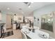 Bright and airy kitchen dining area featuring a modern table set and a view into the living spaces at 11828 Se 91St Cir, Summerfield, FL 34491