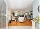Bright and inviting living room with an open floor plan, featuring hardwood floors and comfortable seating areas at 11828 Se 91St Cir, Summerfield, FL 34491