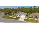 Well-maintained home with lush landscaping, situated on a corner lot with a view of the street at 11828 Se 91St Cir, Summerfield, FL 34491
