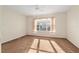Inviting bedroom with plush carpet, bright natural light from the window, and a ceiling fan for comfortable climate control at 13109 Se 86Th Ct, Summerfield, FL 34491