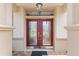 Elegant double front doors with decorative glass and sidelights at 13109 Se 86Th Ct, Summerfield, FL 34491