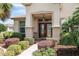Beautiful entryway with lush landscaping and an elegant double door at 13109 Se 86Th Ct, Summerfield, FL 34491
