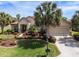 Charming home with a well-manicured lawn, lush landscaping, and inviting curb appeal at 13109 Se 86Th Ct, Summerfield, FL 34491
