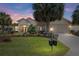 Inviting front yard showcasing lush landscaping and a charming home exterior at 13109 Se 86Th Ct, Summerfield, FL 34491