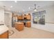 Open kitchen features an island, stainless steel appliances and tiled floors at 13109 Se 86Th Ct, Summerfield, FL 34491