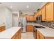 Spacious kitchen features stainless steel appliances, breakfast bar, and generous cabinet space at 13109 Se 86Th Ct, Summerfield, FL 34491