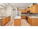 Well-equipped kitchen with stainless steel appliances and light wood cabinets at 13109 Se 86Th Ct, Summerfield, FL 34491