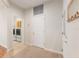 Hallway view to laundry room with washer, dryer, and storage cabinets at 13109 Se 86Th Ct, Summerfield, FL 34491