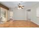 Light and bright living room with a ceiling fan and hardwood floors at 13109 Se 86Th Ct, Summerfield, FL 34491