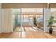 Bright sunroom with sliding glass doors, ceiling fan, and plants, creating a relaxing space to enjoy the view from inside at 13109 Se 86Th Ct, Summerfield, FL 34491