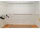 Spacious walk-in closet with ample shelving for organization, including rods and ample storage space for clothes and accessories at 13109 Se 86Th Ct, Summerfield, FL 34491