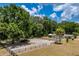 Large property featuring house, horse paddock, and wooded area from above at 13300 Ne 38Th Ave, Anthony, FL 32617