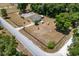 Aerial view of horse property, single Gathering home and surrounding wooded areas at 13300 Ne 38Th Ave, Anthony, FL 32617