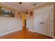 Bedroom featuring wood floors and closet at 13300 Ne 38Th Ave, Anthony, FL 32617