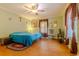 Bedroom with tile floors and ceiling fan at 13300 Ne 38Th Ave, Anthony, FL 32617