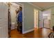 Walk-in closet featuring wire shelving and wood flooring leading to other rooms at 13300 Ne 38Th Ave, Anthony, FL 32617