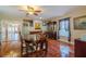 Charming dining room featuring tiled floors, wood furniture, and decorative lighting at 13300 Ne 38Th Ave, Anthony, FL 32617