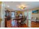 Traditional dining room featuring tiled floors, wood furniture, and large windows for natural light at 13300 Ne 38Th Ave, Anthony, FL 32617