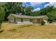 Charming single-story home with stone accents and attached garage at 13300 Ne 38Th Ave, Anthony, FL 32617