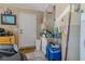 Garage featuring storage cabinets, water heater, and a utility sink for convenience at 13300 Ne 38Th Ave, Anthony, FL 32617